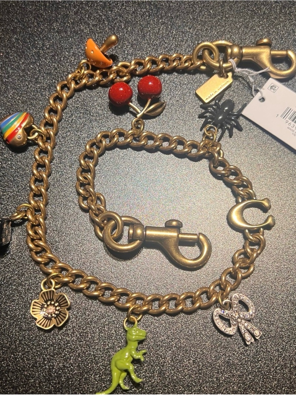 Coach Gold-Tone Charm Strap with Multicolor Enamel Charms - Picture 2 of 2